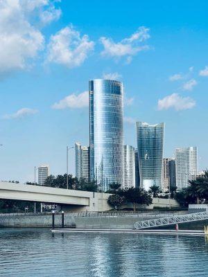 white concrete building near body of water during daytime